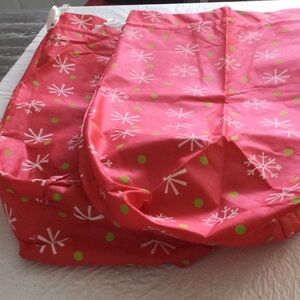 Two Festive Red and Green Vinyl bags with ties strings on top. NWOT